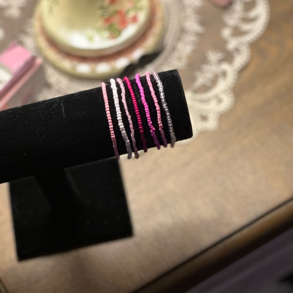 pink and white beaded bracelet set